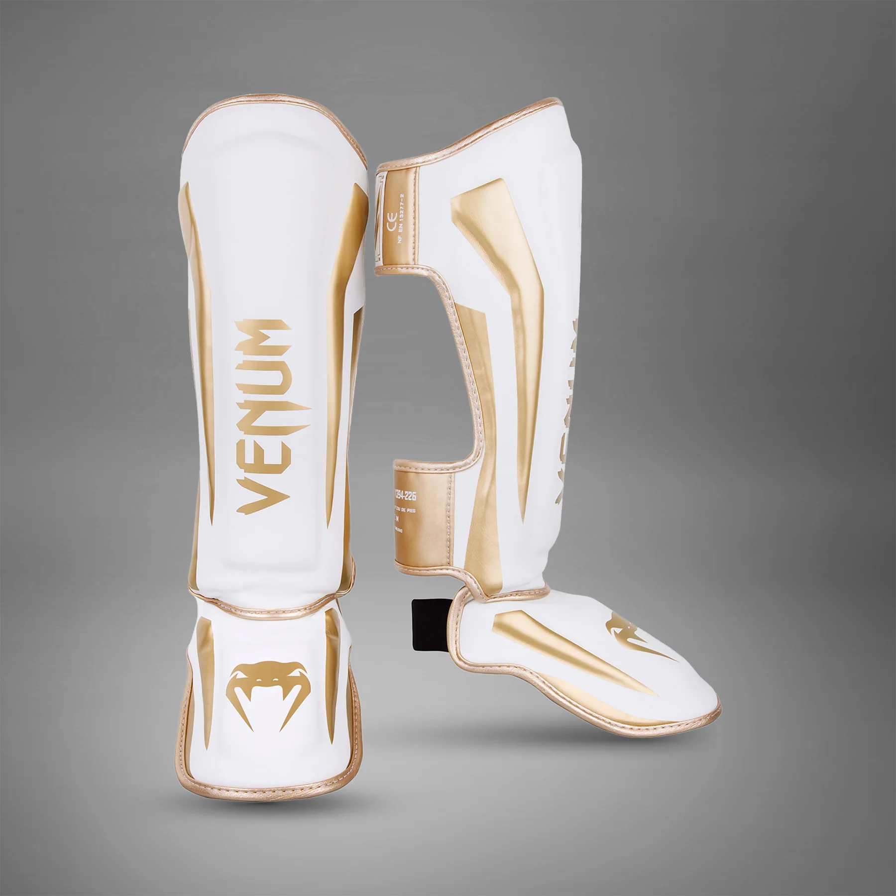 Espinilleras Venum Elite Standup - Blanco/Oro