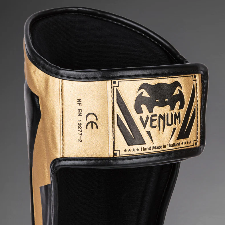 Venum Elite Espinilleras Standup - Oro/Negro - Image 5