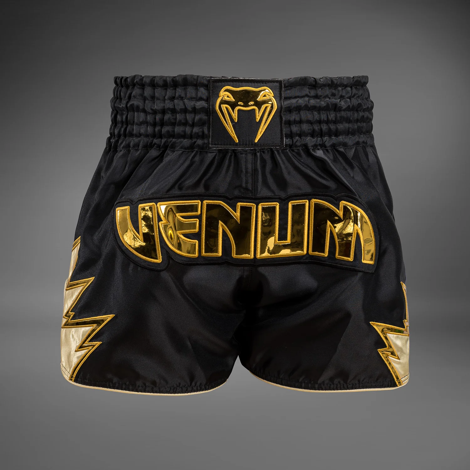 Venum Inferno Pantalones cortos de Muay Thai - Negro/Oro